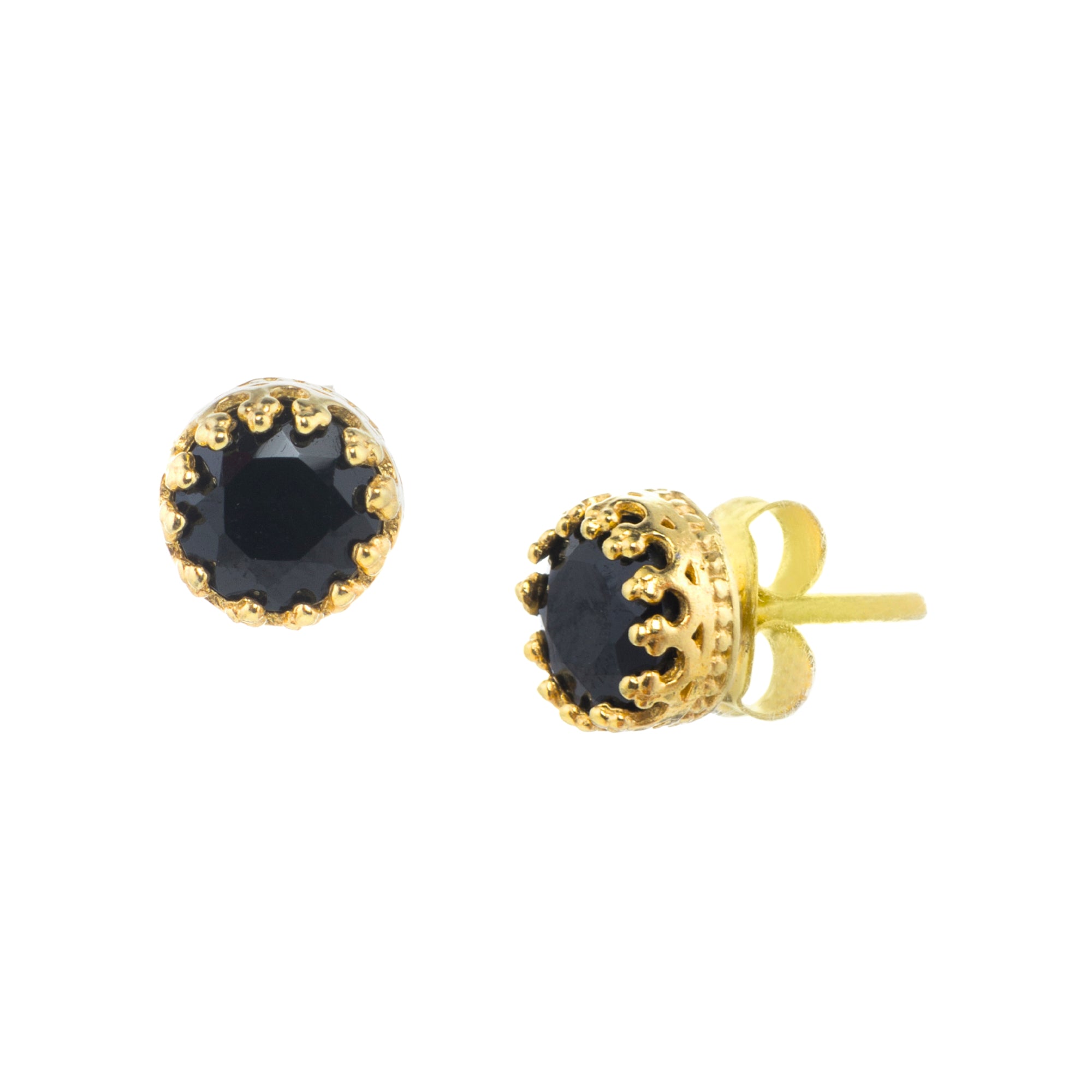 Round faceted 7mm black onyx stud earrings in a gold crown setting on a white background