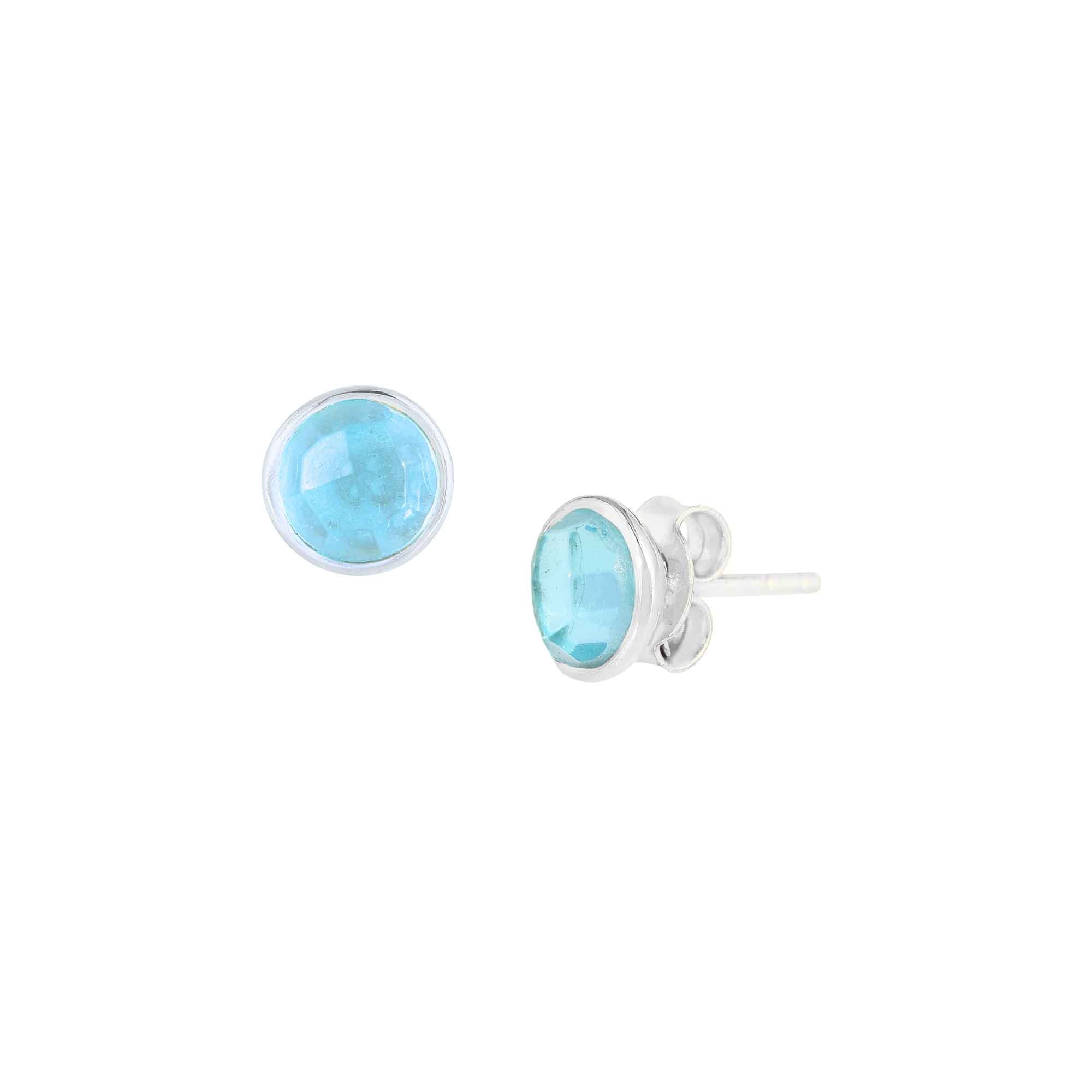 Dew Drops Blue Topaz Bezel Round Stud Earrings Silver — Pair of faceted round natural London Blue Topaz gemstones with vibrant ocean-blue clarity, in a minimal circular bezel setting in high-polish 925 sterling silver, on a butterfly-back post. Product studio shot on white background — Protsaah.