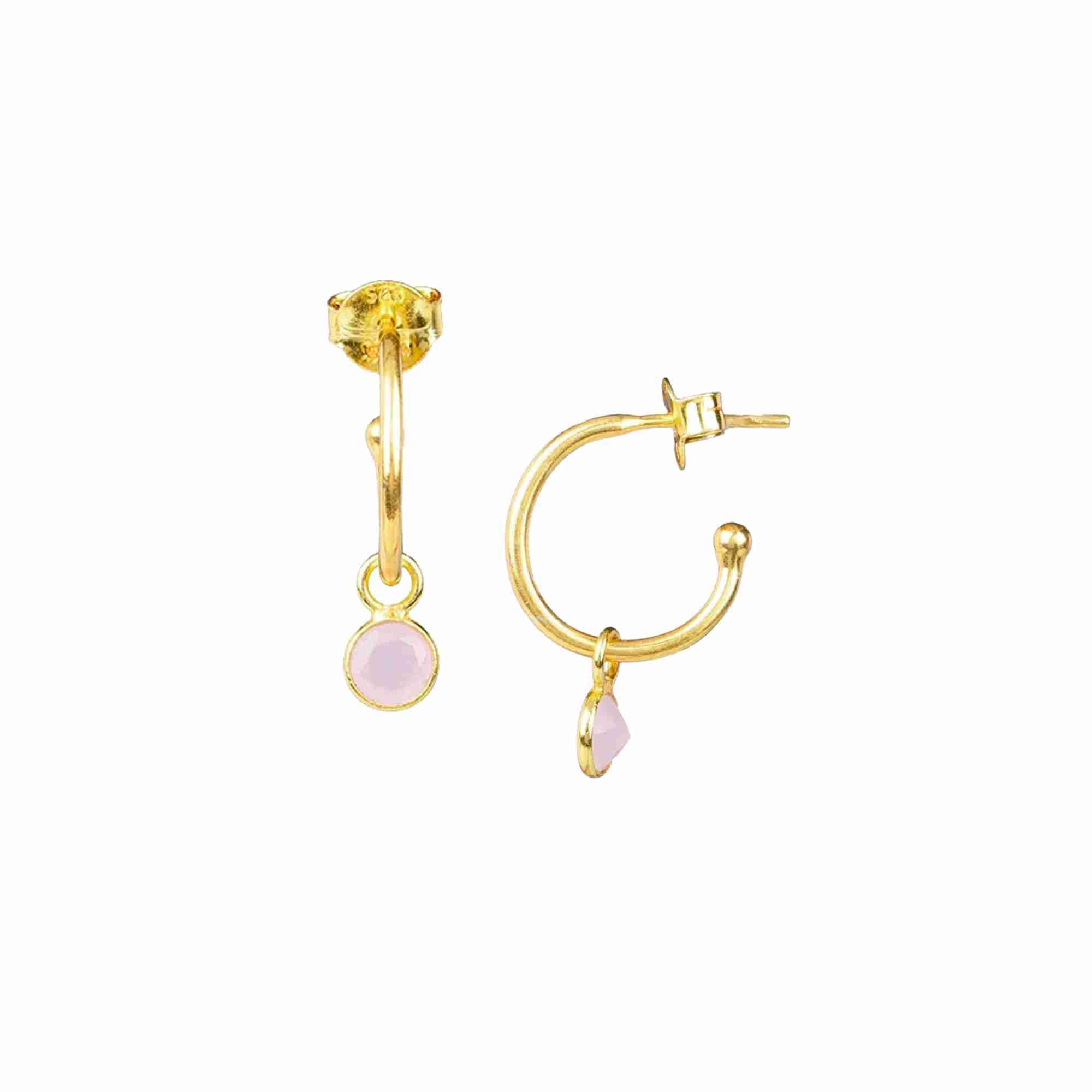 Product picture named Dew Drops displaying a front view and side profile view of the Hoop Earrings with Pink Chalcedony Charm Gold against a plain white background, showcasing a pair of delicate, polished 22K gold vermeil huggie hoops with dangling bezel-set round-cut translucent pastel pink Chalcedony gemstone charms and secure post-and-butterfly back closures by Protsaah Zurich.