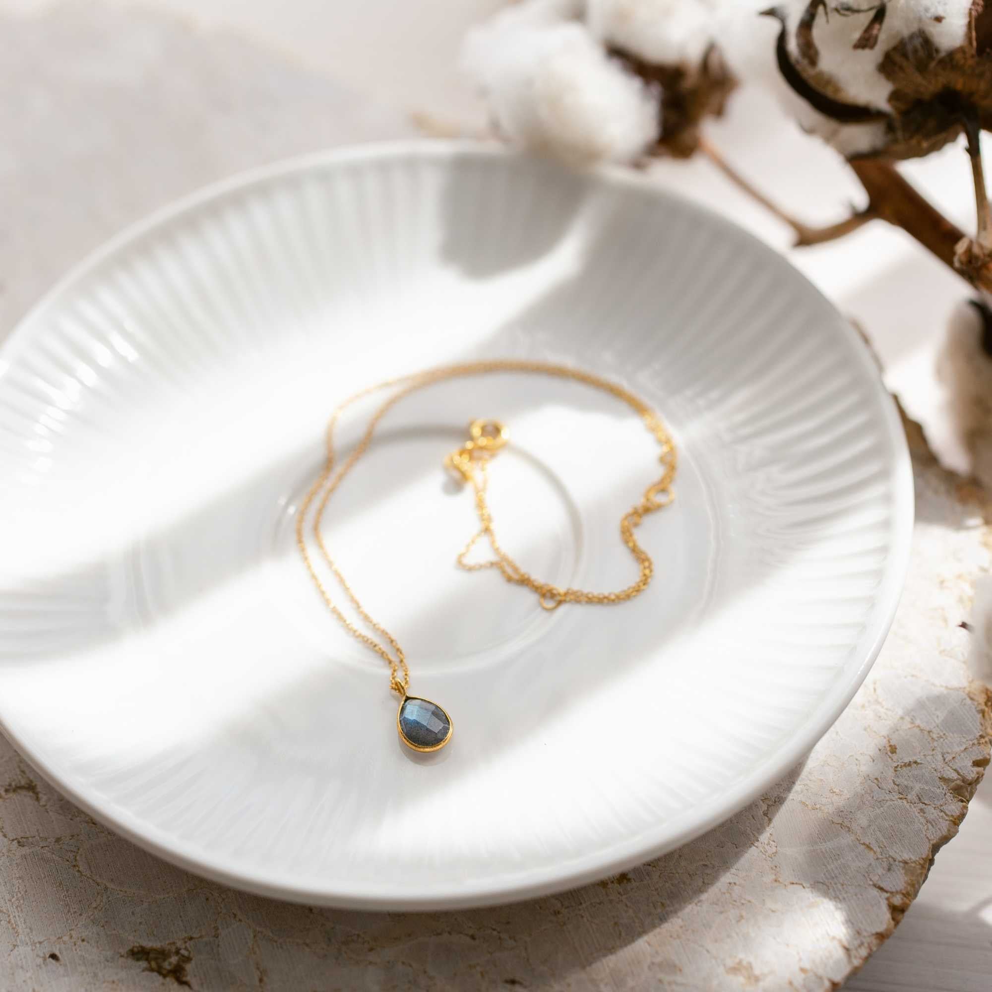 Styling collage of Dew Drops Labradorite Teardrop Pendant Necklace Gold — multiple views of the labradorite pendant in 22K gold vermeil by Protsaah Zurich.