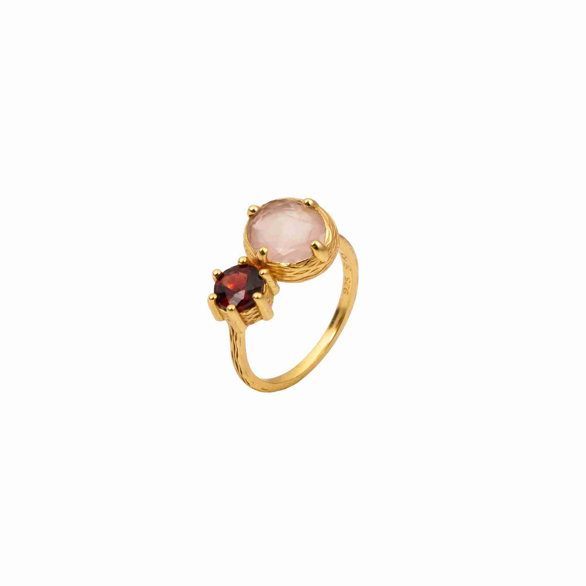 Product picture named Kaleidoscope displaying a side angle of the Kaleidoscope Toi et Moi Cocktail Ring Gold Rose Quartz & Garnet against a solid white backdrop, showcasing the detailed texture of the gold band and the secure multi-prong settings of both gemstones by Protsaah Zurich.