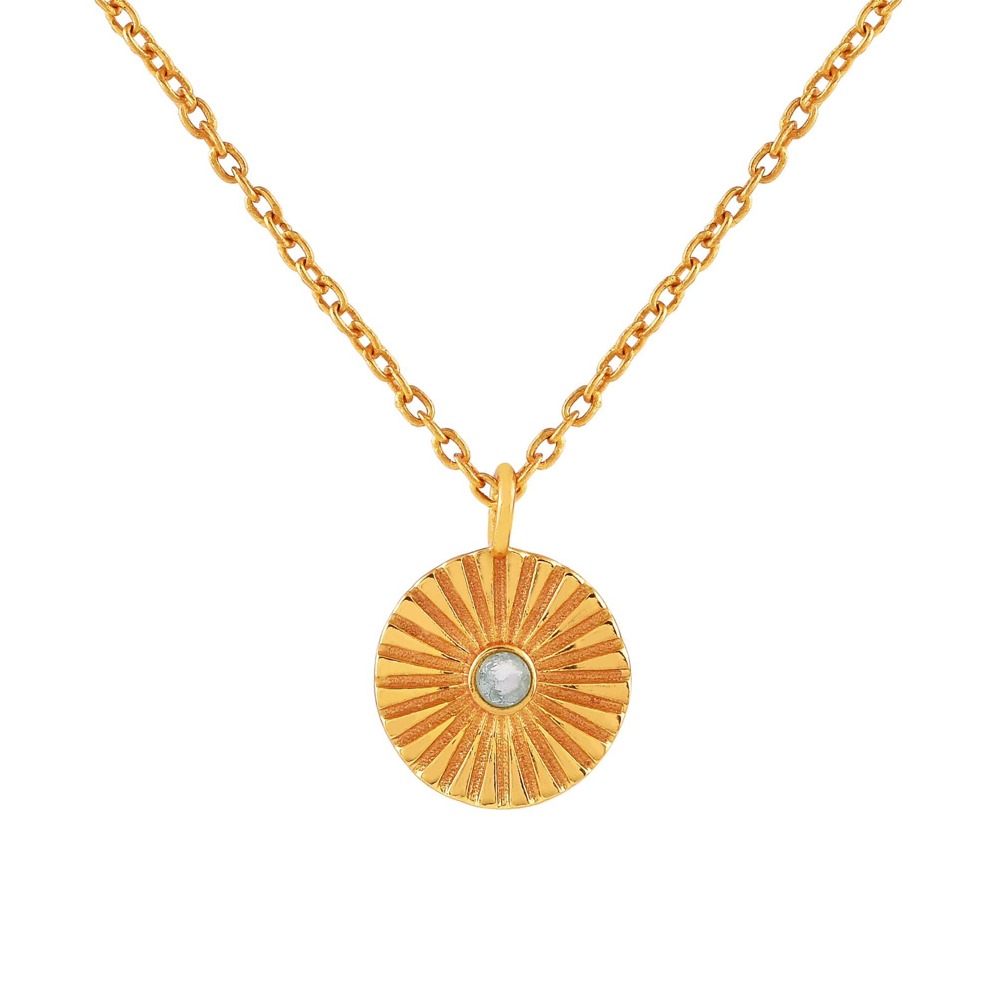 Gold fluted medallion coin pendant necklace featuring a round bezel-set light blue topaz gemstone on a fine gold chain.