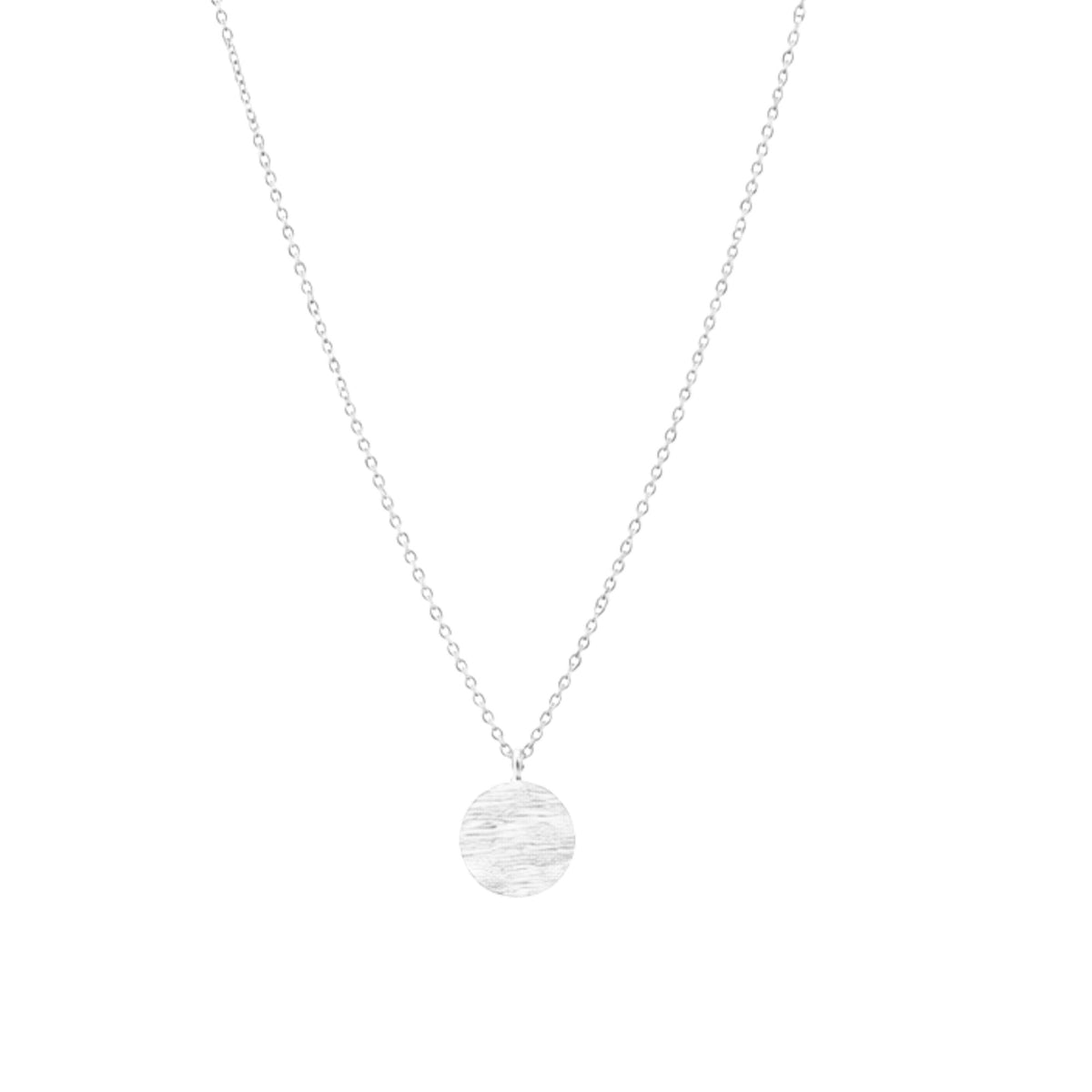 Close-up of the folded silver split-disc pendant showing its hand-brushed surface and central slit