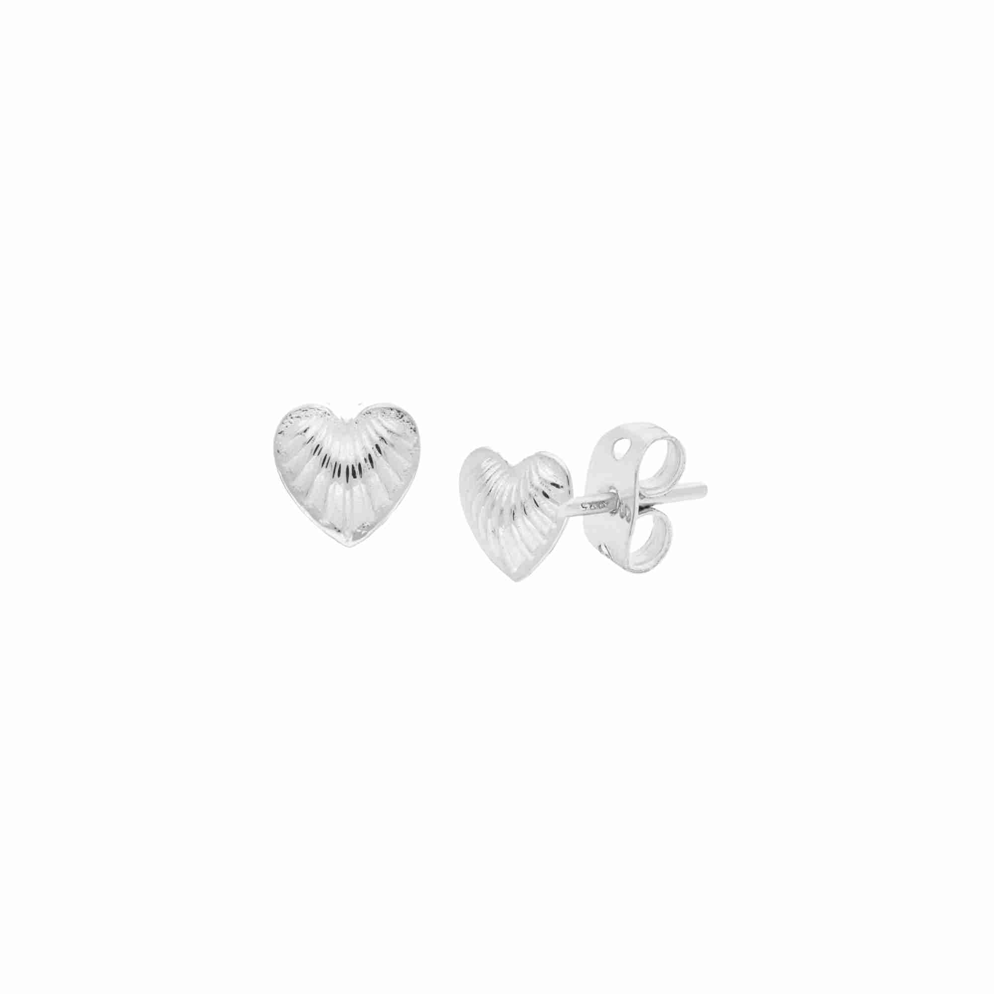 Queen of Charms Fluted Heart Stud Earrings Silver — petite heart-shaped silver studs with radiating fluted texture by Protsaah Zurich.