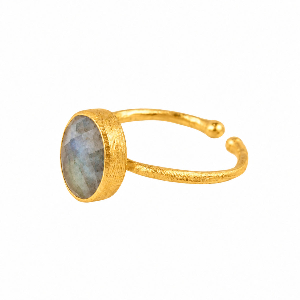 Side view of the labradorite oval hammered adjustable ring in gold, brushed collet and open band, on a white background