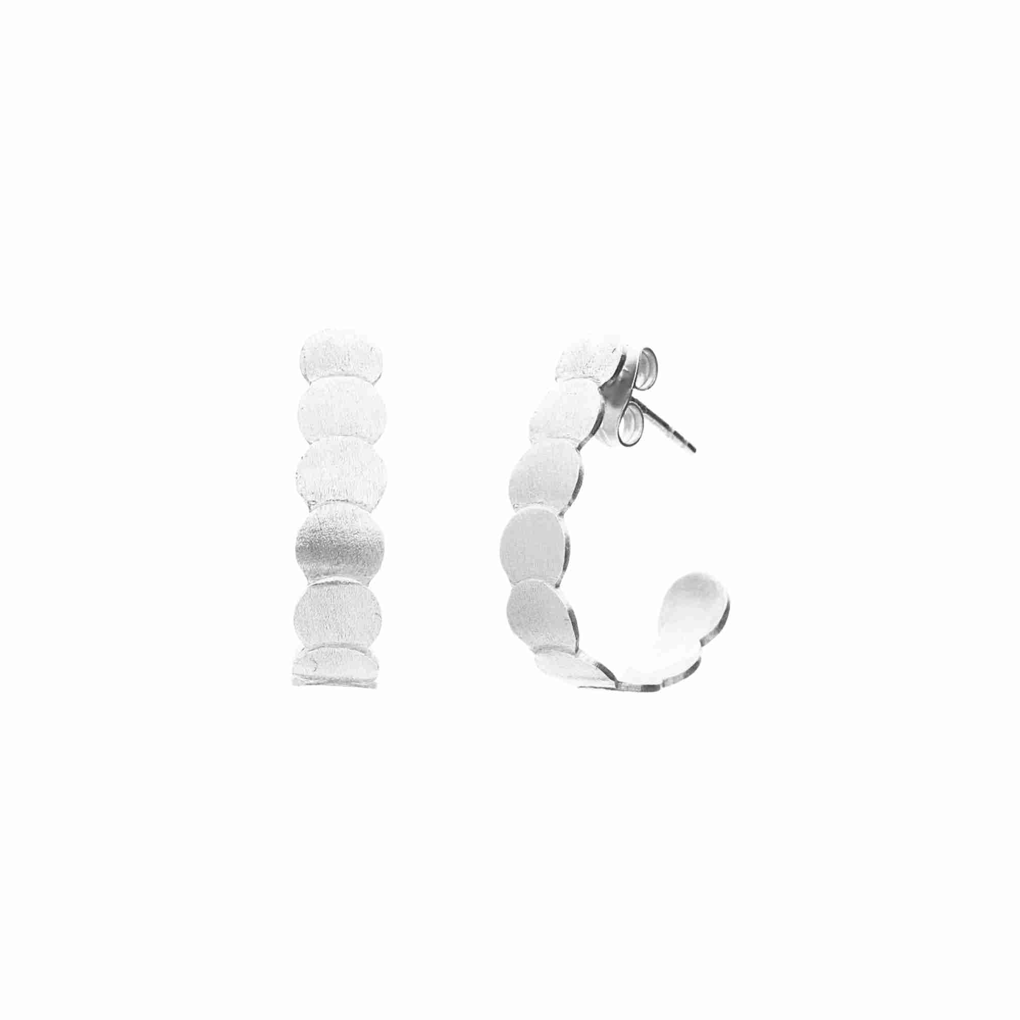 Shimmering Disks Cascading Silver Hoops; a vertical row of overlapping recycled silver circular plates with a signature brushed-satin texture.