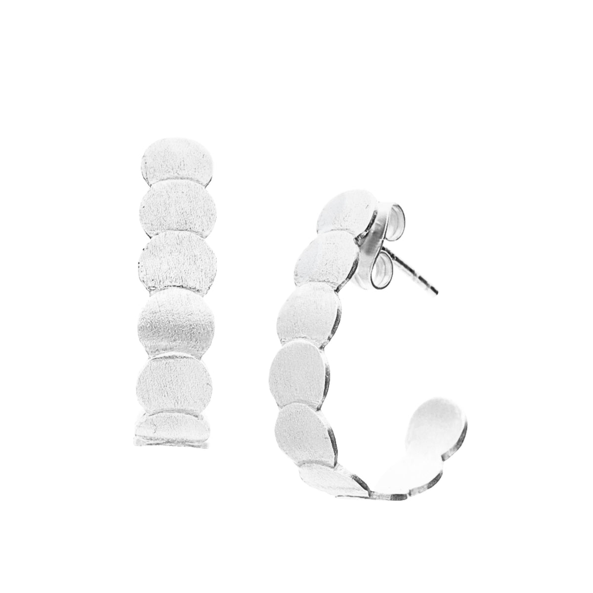 Brushed disc hoop earrings in silver with a hand-brushed finish on a white background