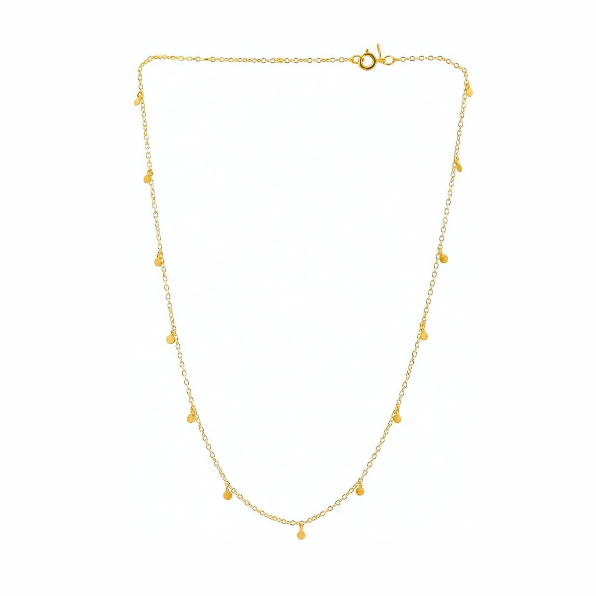 Constellation disc chain necklace in gold with tiny hand-brushed discs on a fine chain on a white background