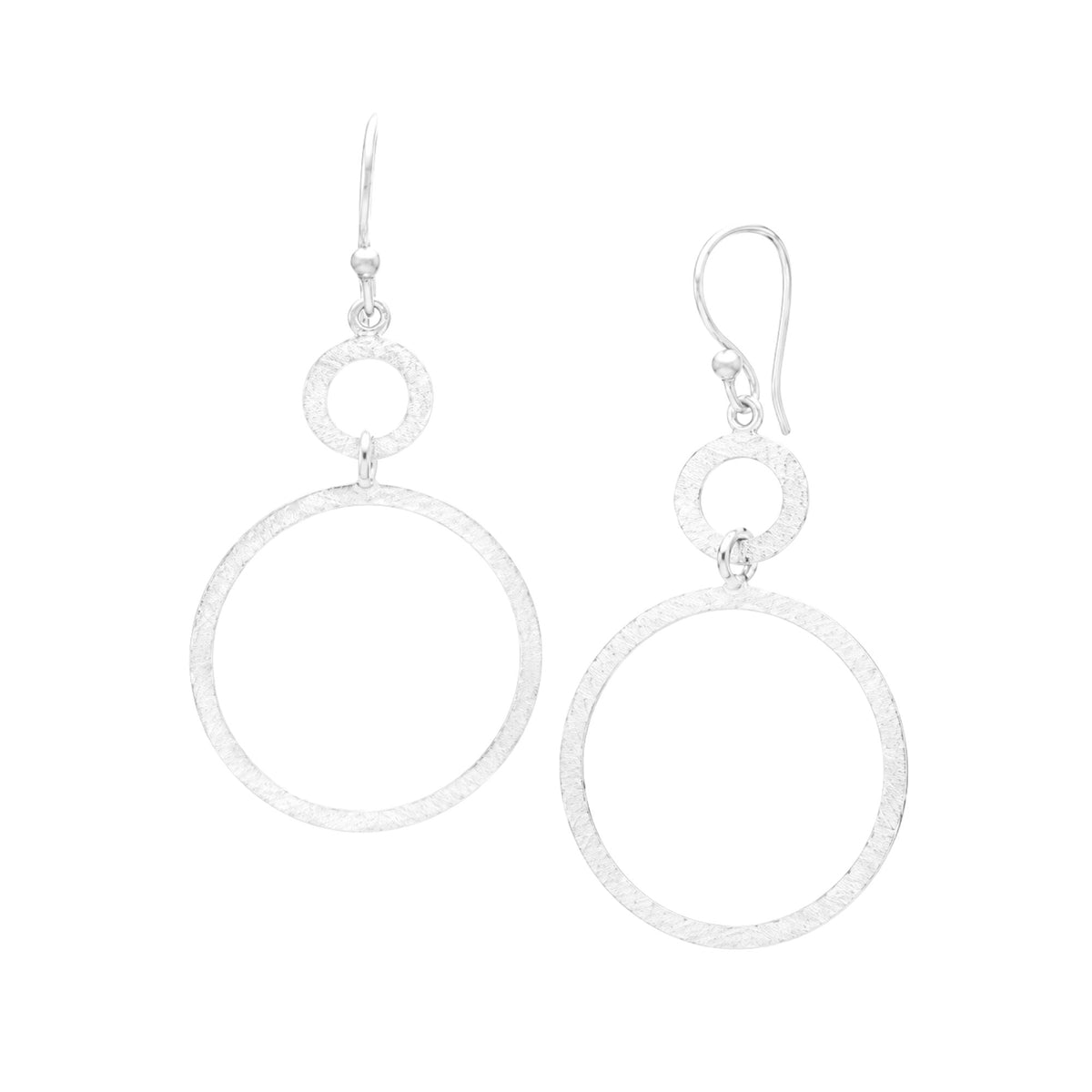 Double Circle statement earrings in silver with a hand-brushed finish on a white background