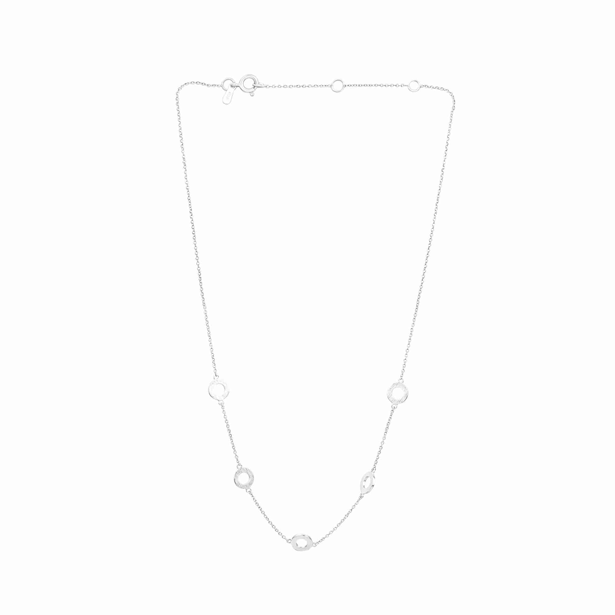 Protsaah Zurich Shimmering Disks silver open circles choker necklace featuring five architectural rings with a hand-applied cross-hatch scratch finish on a polished 92.5 recycled silver cable chain.