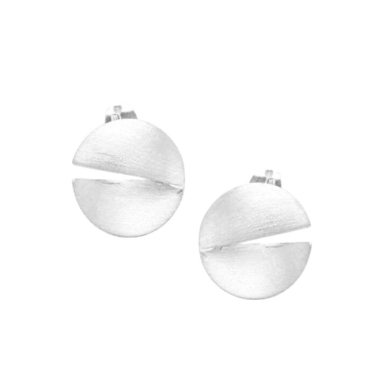 Sculptural split-disc stud earrings in silver with a hand-brushed finish on a white background