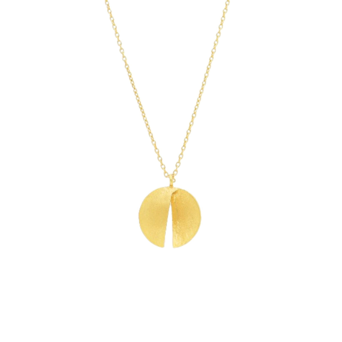 Close-up of the folded gold split-disc pendant, its two halves catching the light differently
