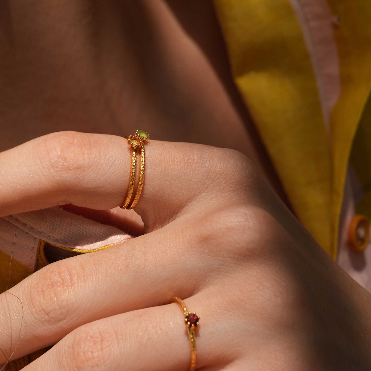 Delicate Vintage Aqua Chalcedony Dotted Band Ring Gold — Hand wearing a gold ring with an aqua chalcedony gemstone. By Protsaah Zurich.