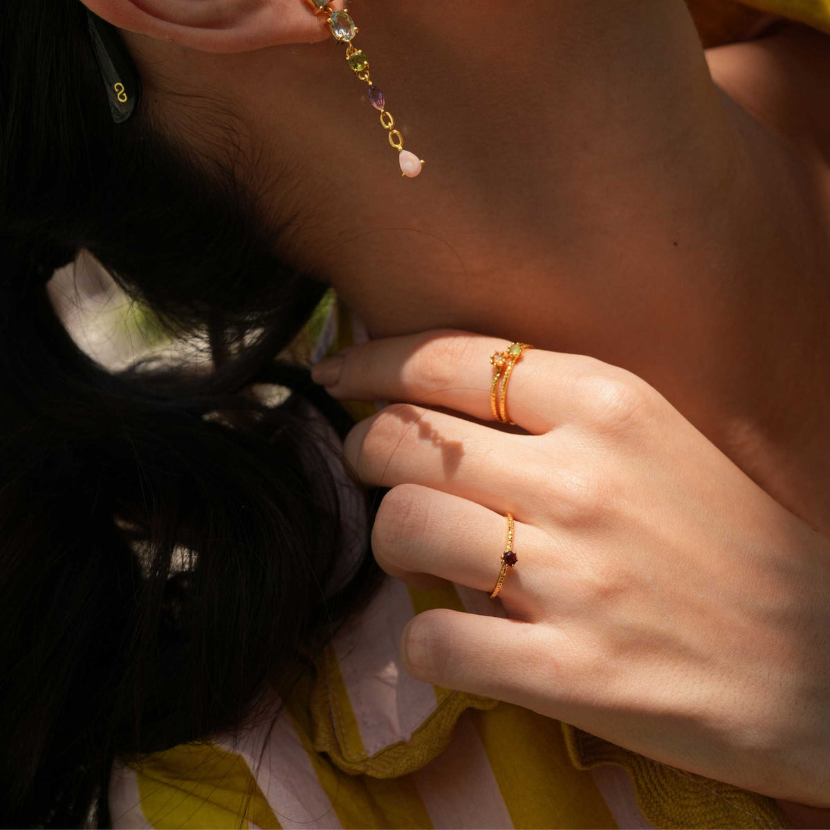 Delicate Vintage Aqua Chalcedony Dotted Band Ring Gold — Hand wearing a gold ring with an aqua chalcedony gemstone. By Protsaah Zurich.
