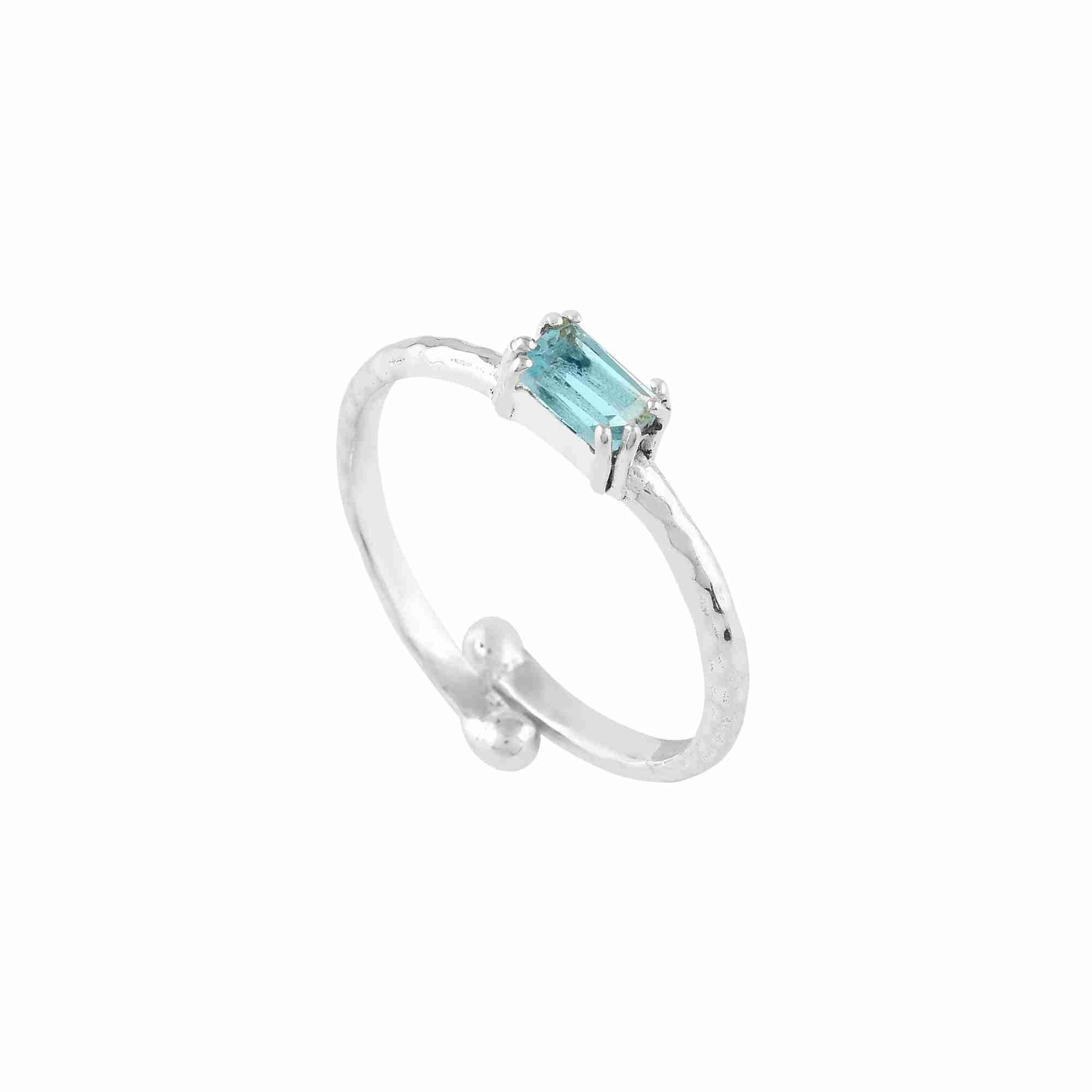 Delicate Vintage Blue Topaz Baguette Ring Silver — an adjustable 92.5 sterling silver bypass ring featuring a horizontally set step-cut baguette blue topaz on a 1.3 mm hammered texture band by Protsaah Zurich.