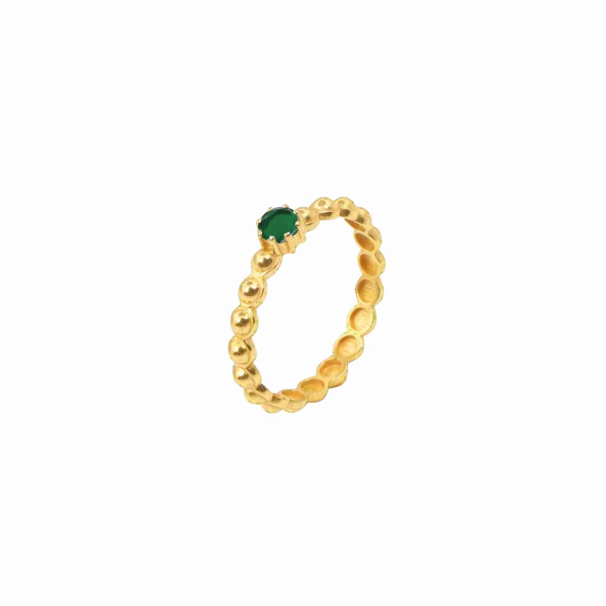Product picture displaying a tilted, three-quarter side angle view of the Delicate Vintage Green Onyx Beaded Dotted Eternity Ring Gold against a plain white background, highlighting the raised profile of the prong-set translucent emerald-green Onyx stone and the hollowed inner comfort-fit silhouette of the textured 22K gold vermeil beaded band by Protsaah Zurich.