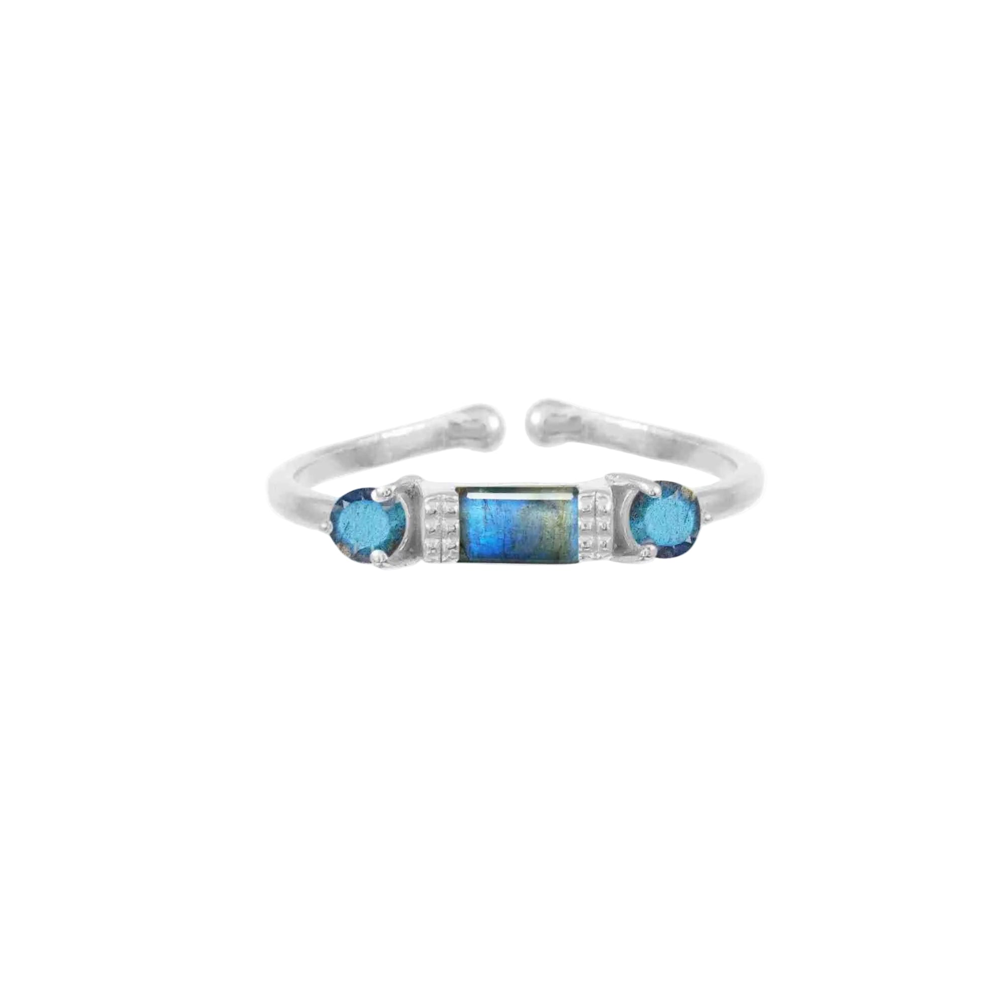 Front-facing view of the Delicate Vintage Labradorite Three-Stone Ring featuring a central baguette-cut labradorite flanked by two round blue topaz stones on a thin open-shank silver band.