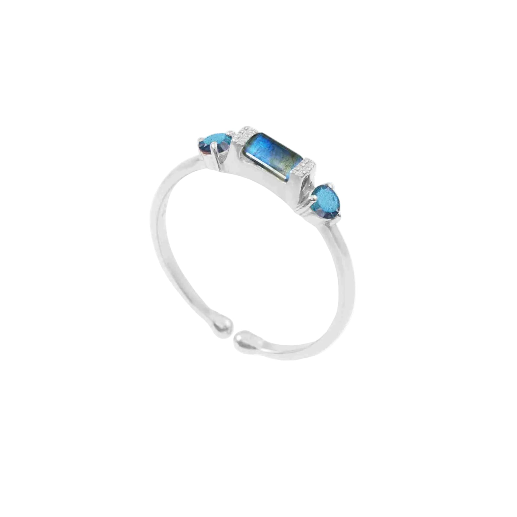 Silver three-stone ring with baguette labradorite and round blue topaz in 92.5 recycled sterling silver.