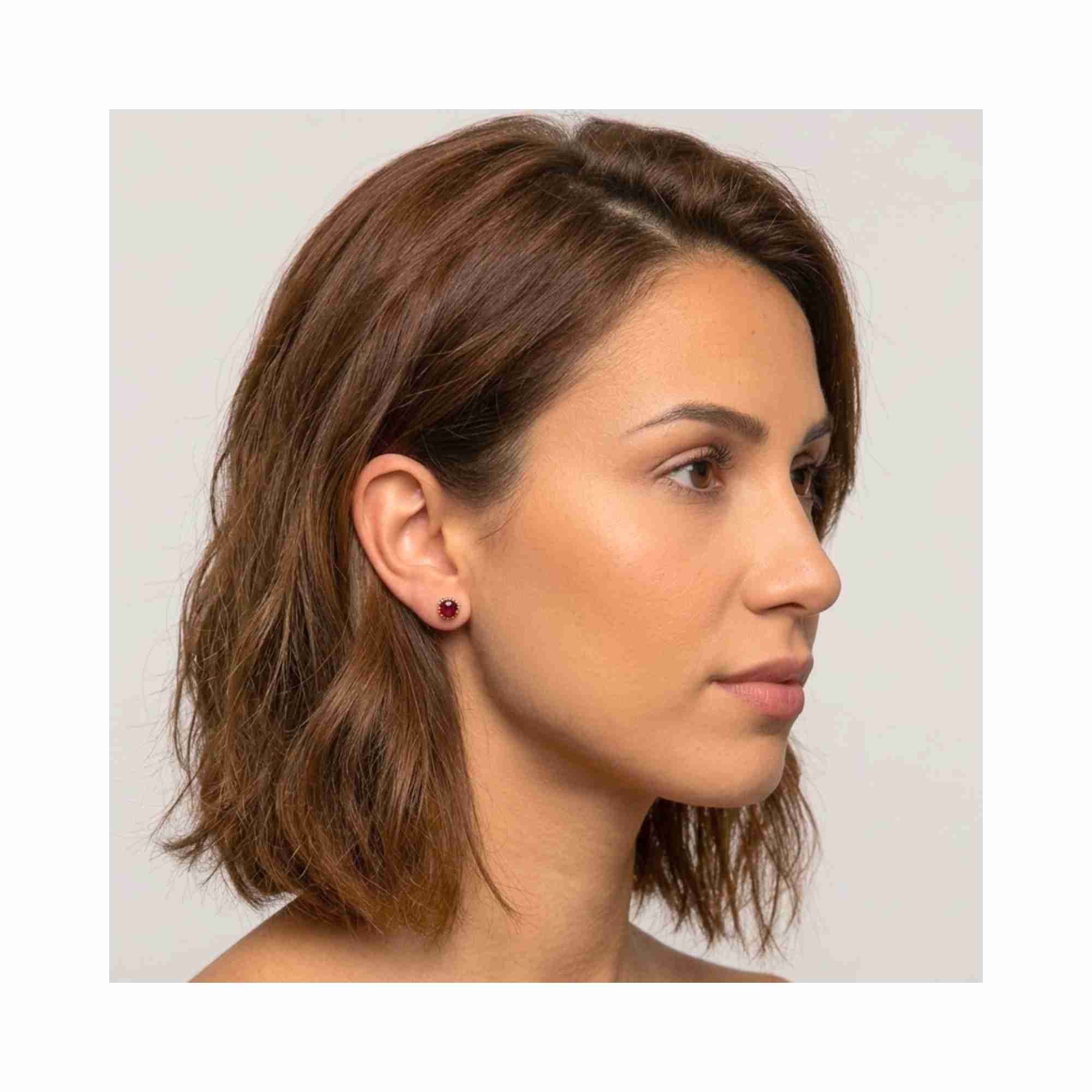 Model wearing Dew Drops Garnet Crown Stud Earrings in 22K gold vermeil, handcrafted sustainable gemstone jewelry Protsaah Zurich.
