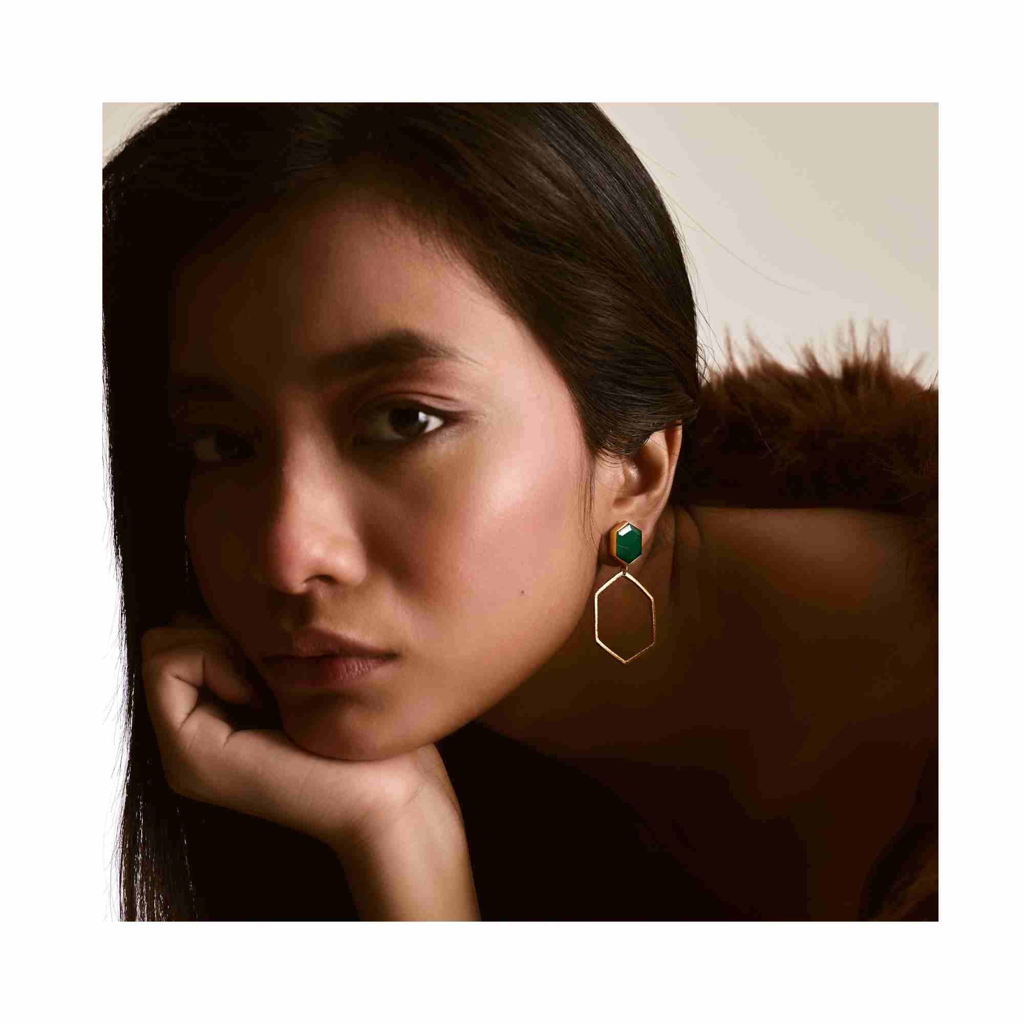 Detail shot of Geo Glam Hexagonal Green Onyx Statement Earrings Gold — hand-textured gold post with emerald-green onyx gemstone by Protsaah Zurich.