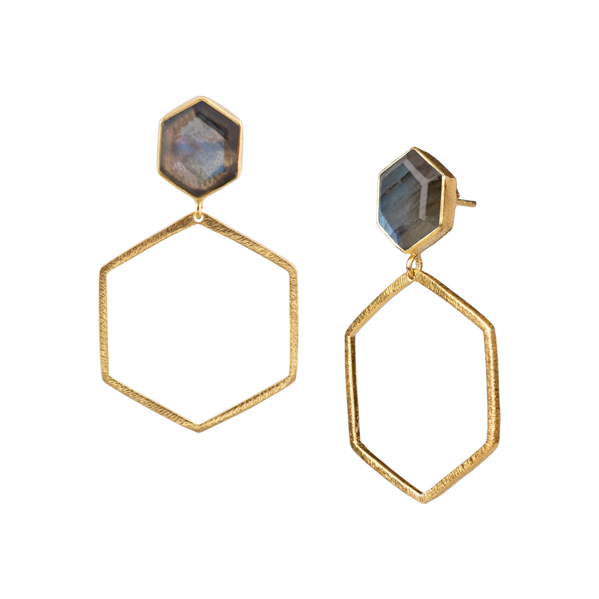 Product photography of Geo Glam Hexagonal Labradorite Statement Earrings Gold, highlighting the faceted labradorescent gemstone suspended inside a large, open hexagonal drop frame below a hand-textured matte gold post — Protsaah Zurich.