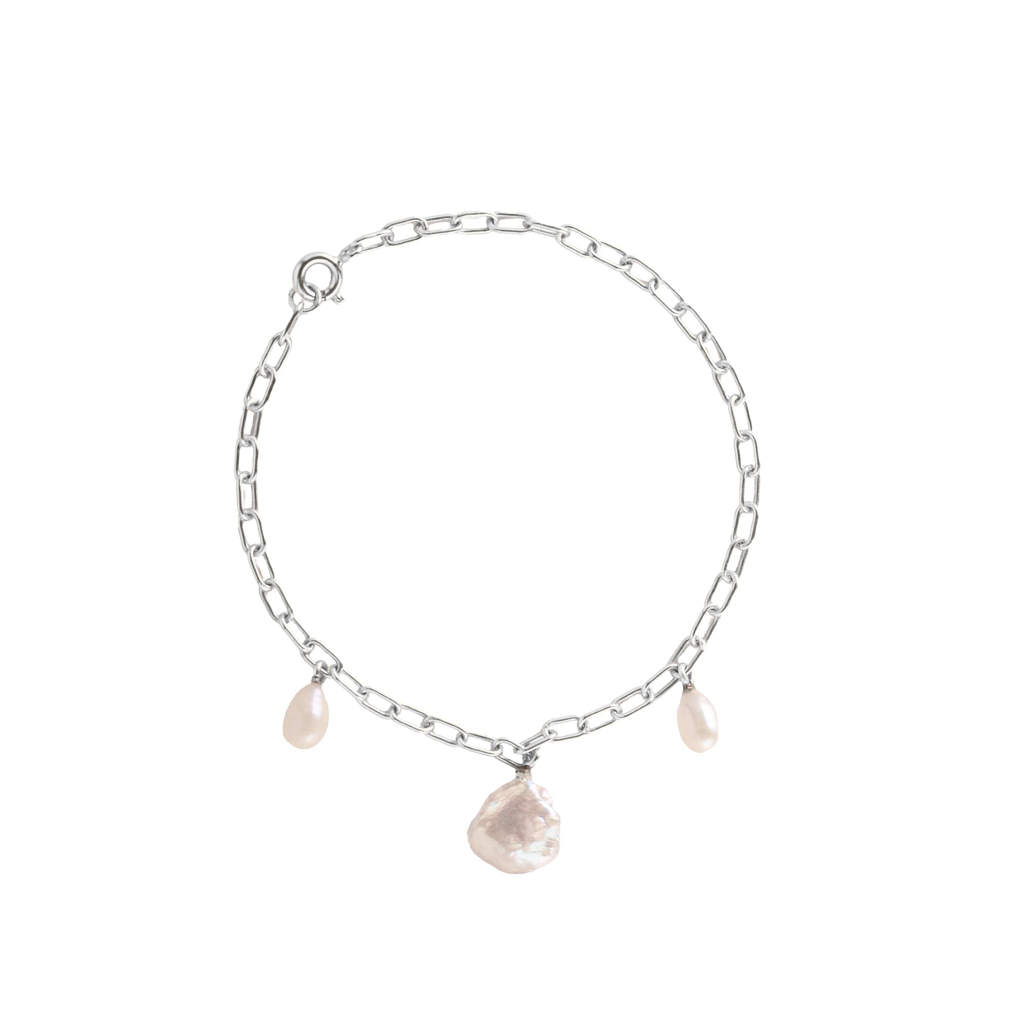 PEARLS GALORE Silver Pearl Bracelet; a delicate recycled silver chain bracelet featuring three white baroque pearls, handcrafted by Protsaah Zurich.