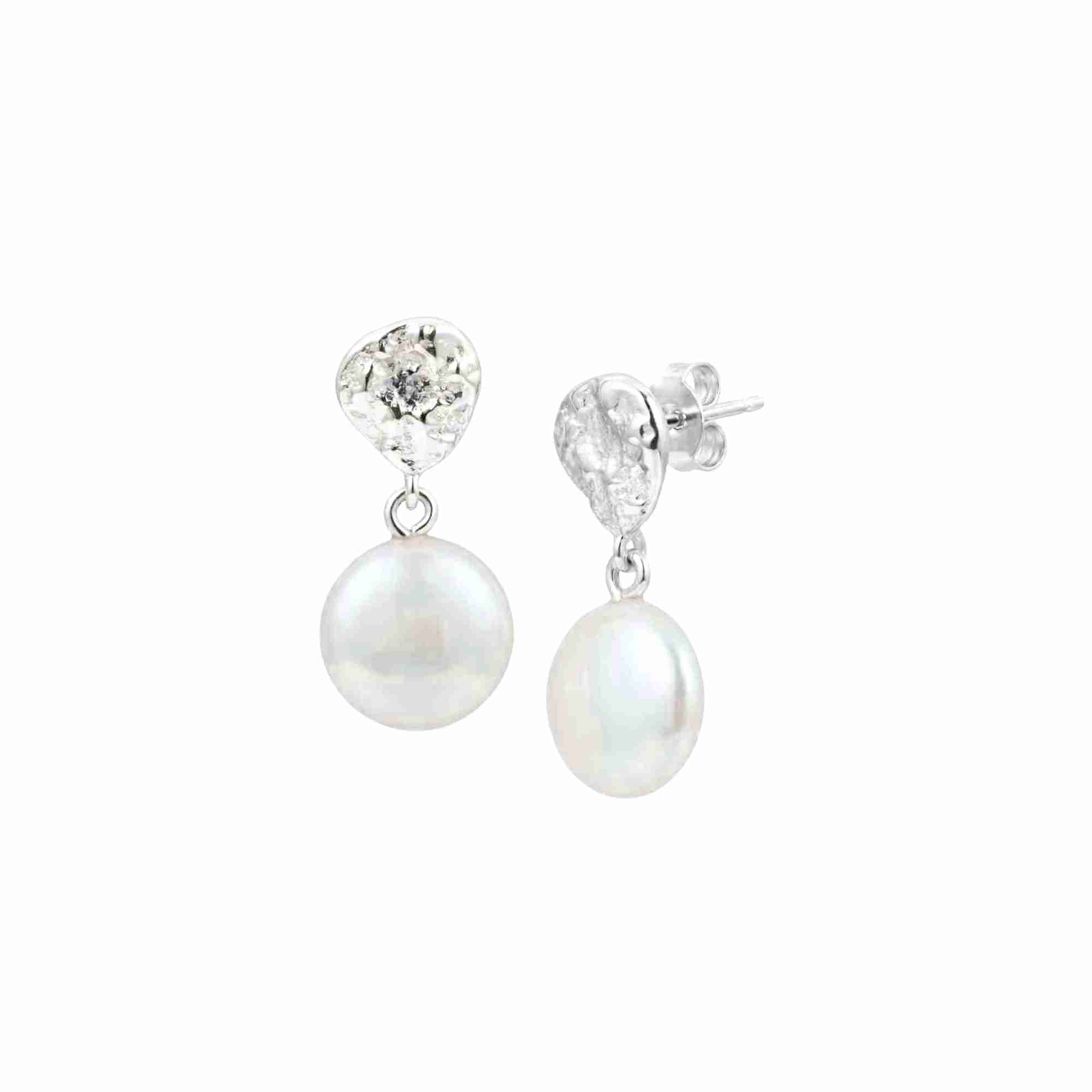PEARLS GALORE Silver Keshi Pearl Earrings; organic hammered silver teardrop studs with flat iridescent pearls, handcrafted in 92.5 recycled silver by Protsaah Zurich.