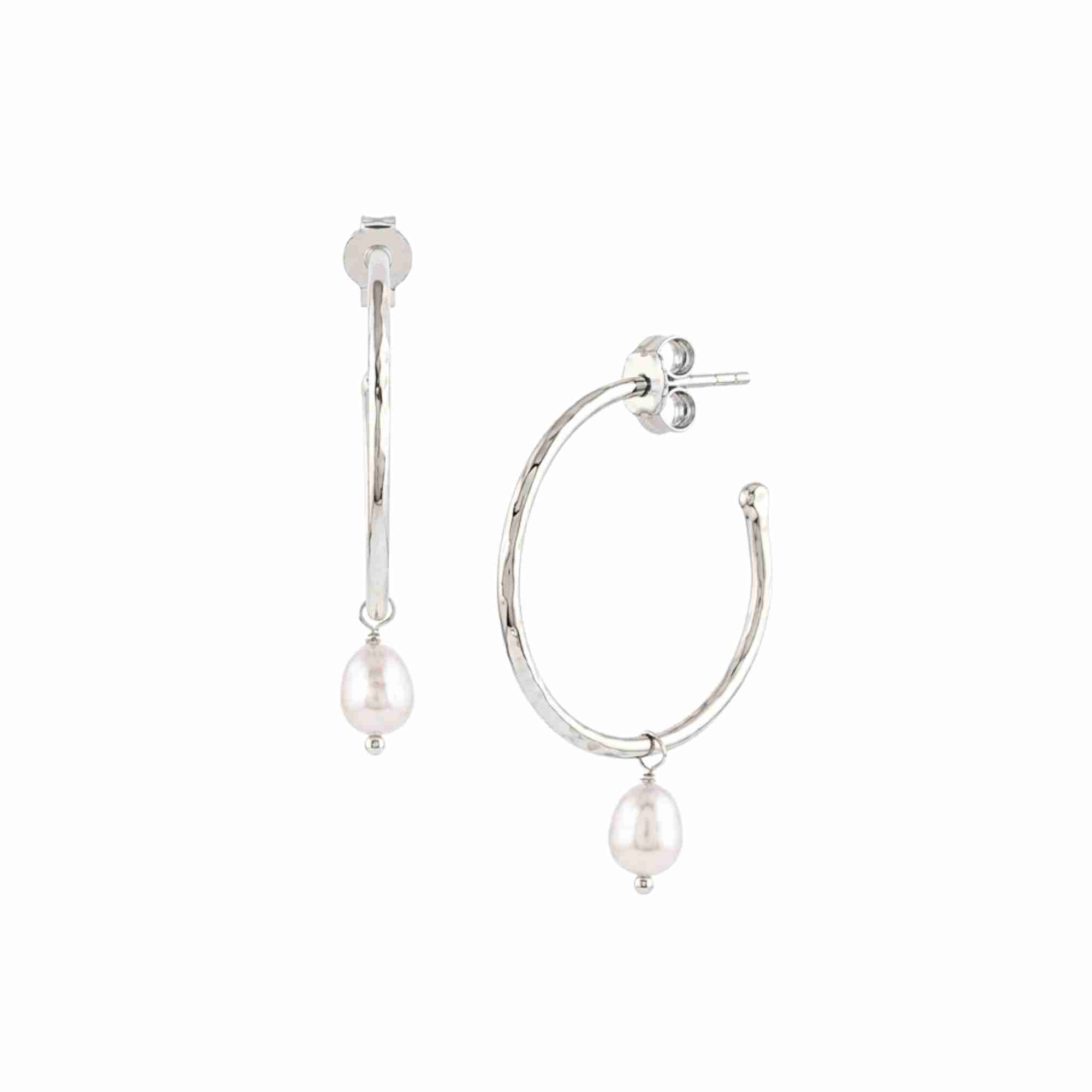 PEARLS GALORE Silver Hoop Earrings; hammered silver hoops with a single dangling freshwater pearl drop in 92.5 recycled silver.