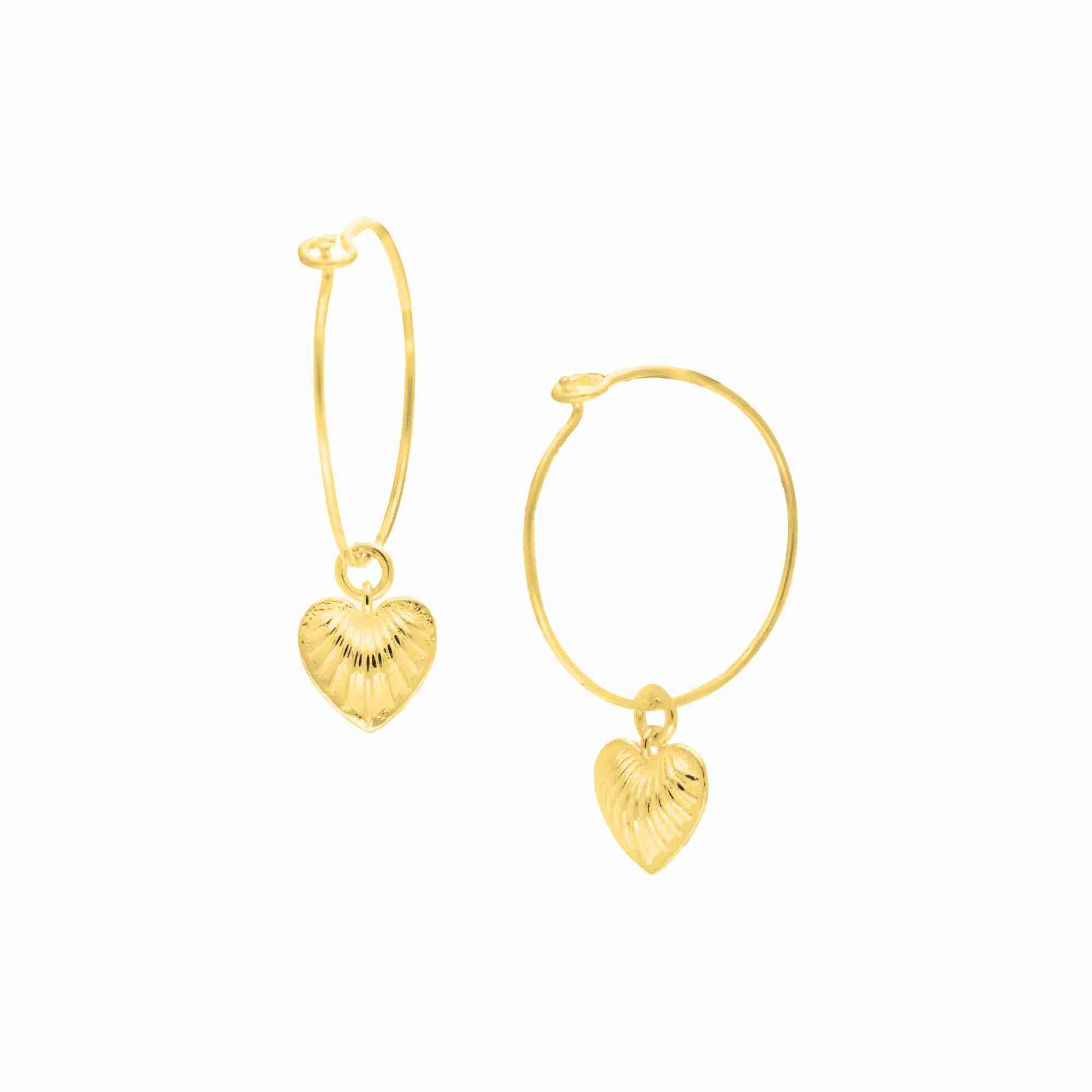 Queen of Charms Fluted Heart Charm Hoop Earrings Gold — delicate gold wire hoops with a textured radiating heart charm drop by Protsaah Zurich.