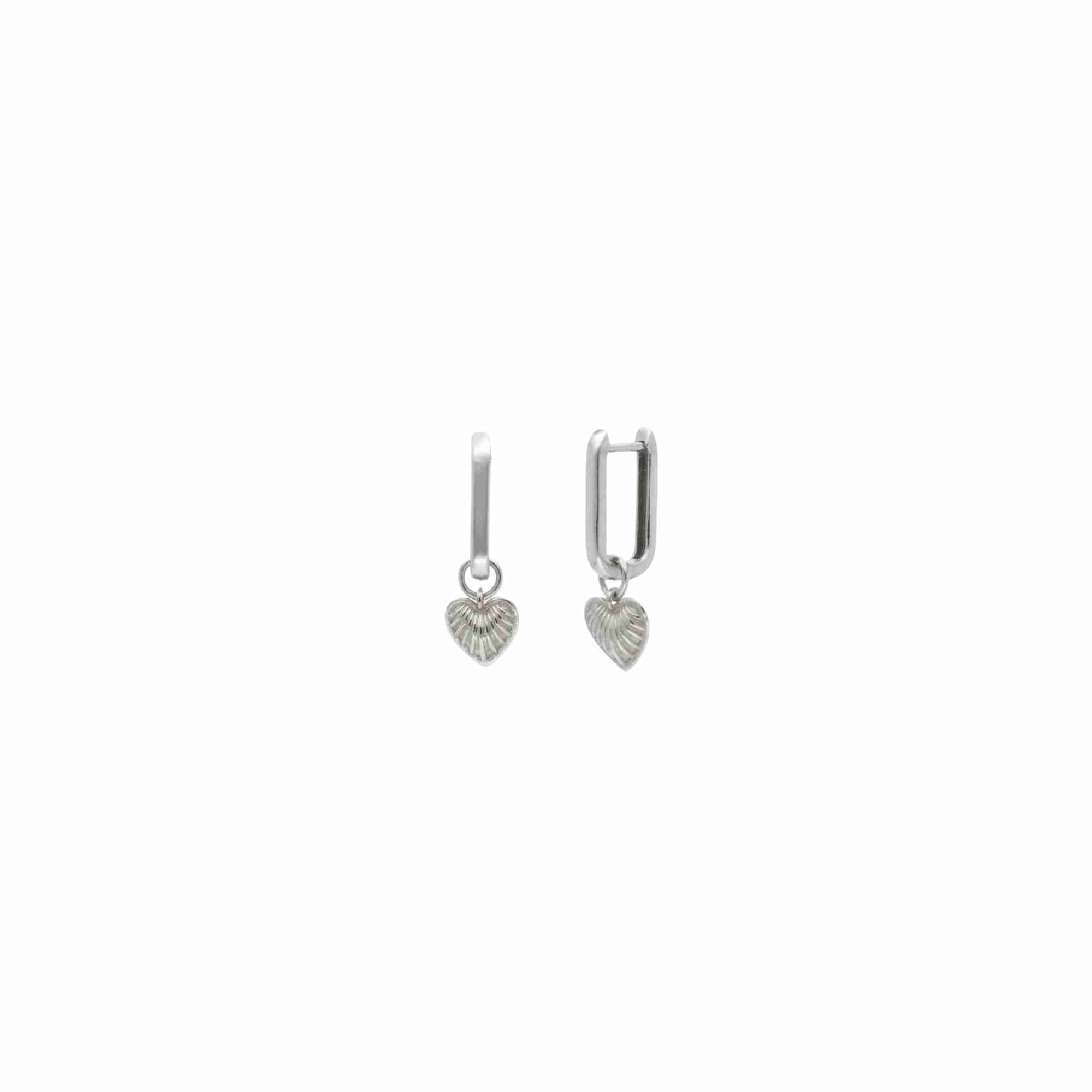 Queen of Charms Fluted Heart Huggie Hoop Earrings Silver — rectangular huggie hoop with fluted heart charm drop in 92.5 recycled silver by Protsaah Zurich.