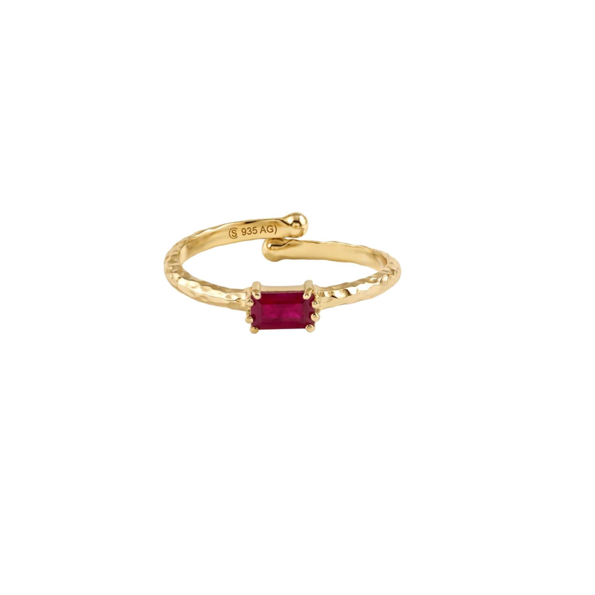 Gold baguette ruby jade adjustable ring in 22K gold-plated sterling silver front view.Front-facing view of the Delicate Vintage Ruby Jade Baguette Ring featuring a horizontally set baguette-cut ruby jade stone centered on a hammered 22K gold-plated open-shank band showing inner hallmarks. Gold ruby jade baguette ring front view.
