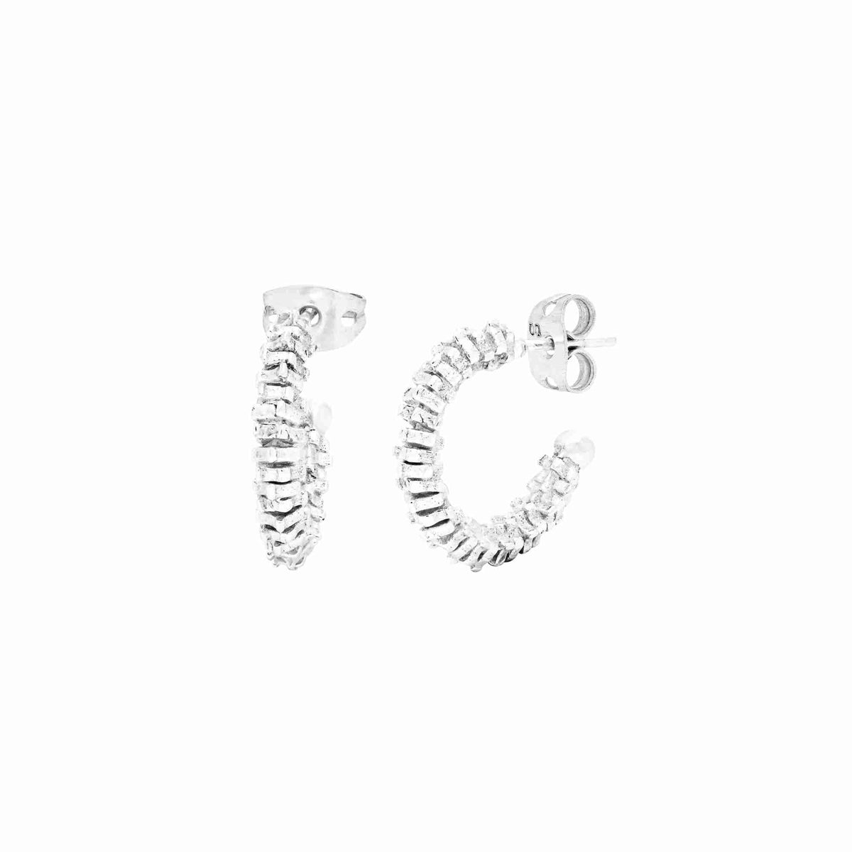 Open hoop earrings with ruffled fold texture in polished silver on a white background