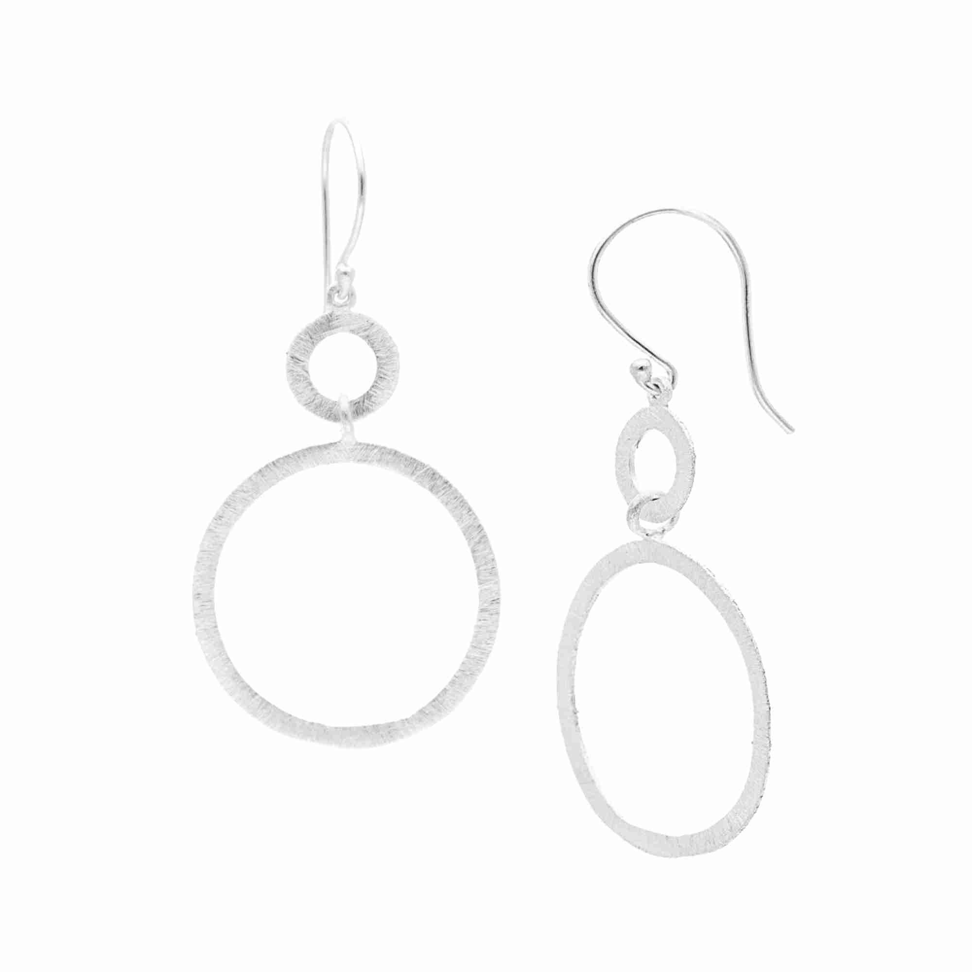 Shimmering Disks Dual Circle Statement Earrings Silver — nested double open-circle drop with hand-applied cross-hatch scratch finish in 92.5 recycled sterling silver by Protsaah Zurich.