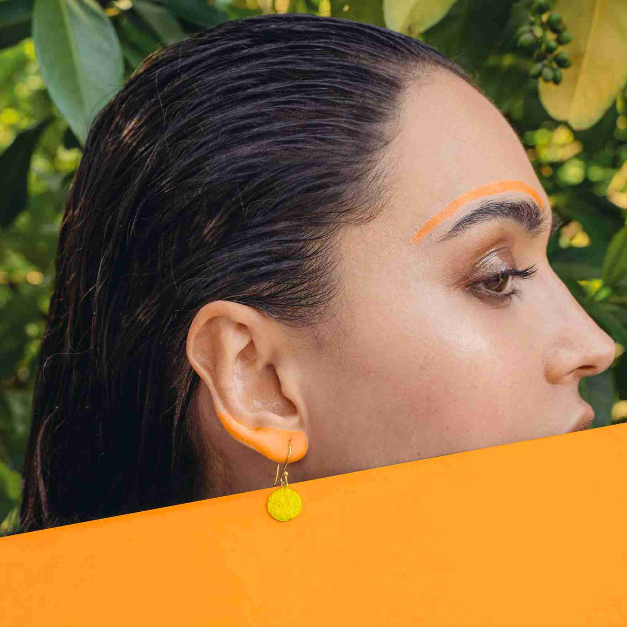Detailed layout view of a single Shimmering Disks Minimalist Coin Drop Earring Medium Gold on a white backdrop, highlighting the fine texture alignment, connection loop, and rich gold plated 925 Silver luster.