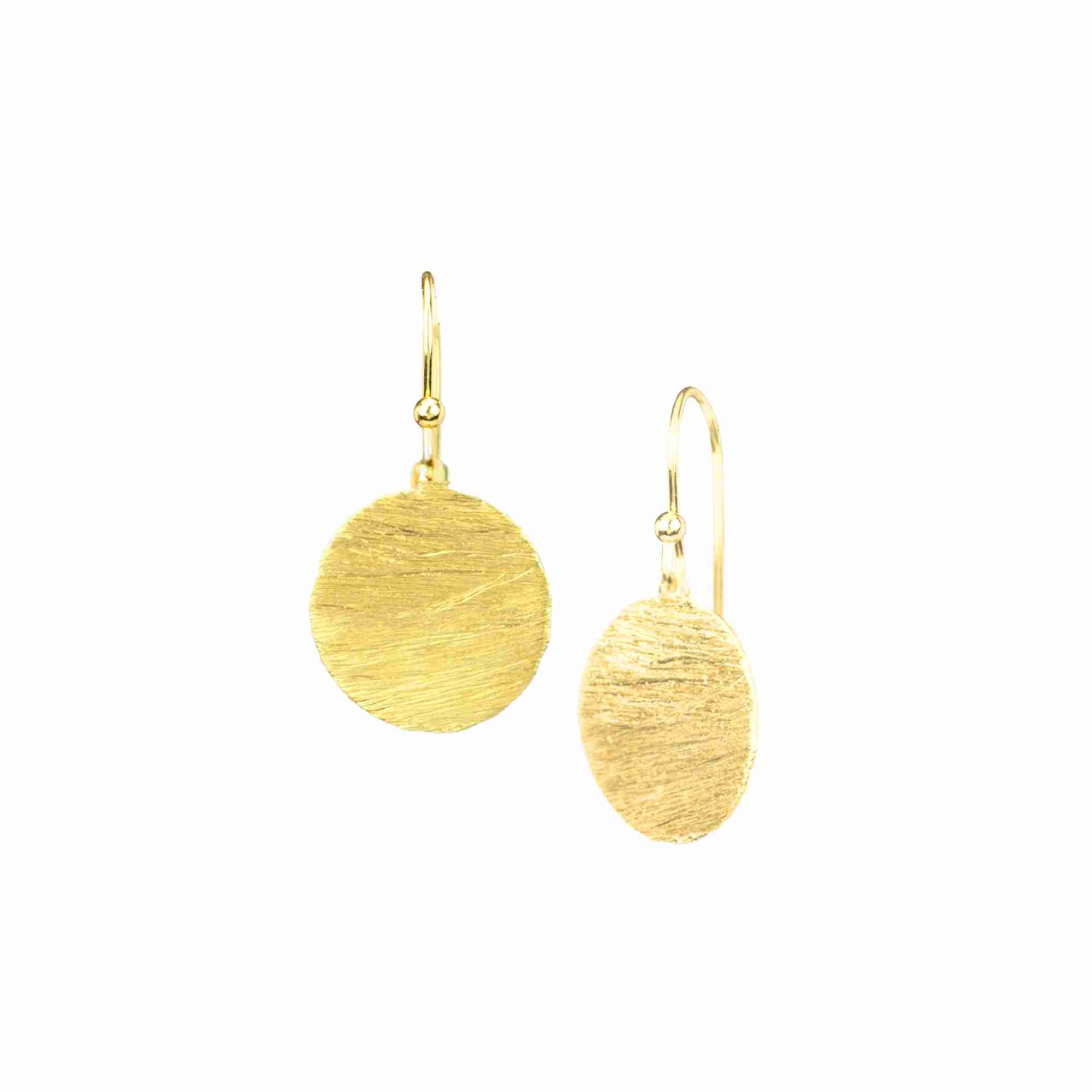 
Shimmering Disks Gold Medium Drop Earrings; minimalist circular coin drops with a signature brushed-satin gold finish over 92.5 recycled silver.
