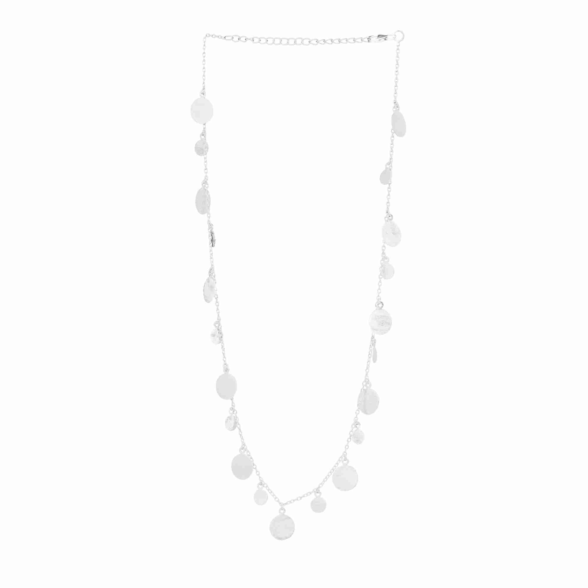 
Shimmering Disks Silver Station Necklace; long chain necklace with multiple circular disks and a signature brushed-satin finish over 92.5 recycled silver.
