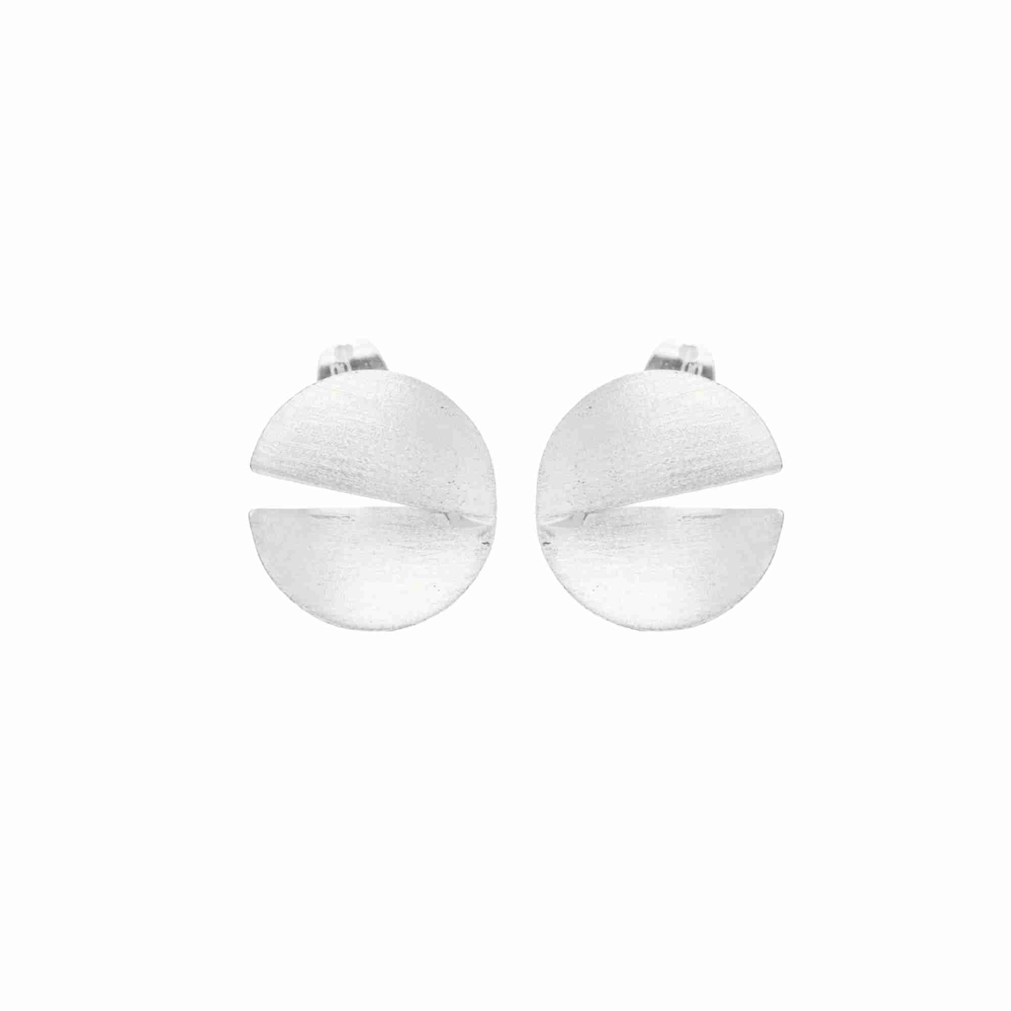 Sculptural Silver Disc Studs; circular folded earrings in recycled silver with a brushed-satin finish, artisanal statement jewelry by Protsaah Zurich.