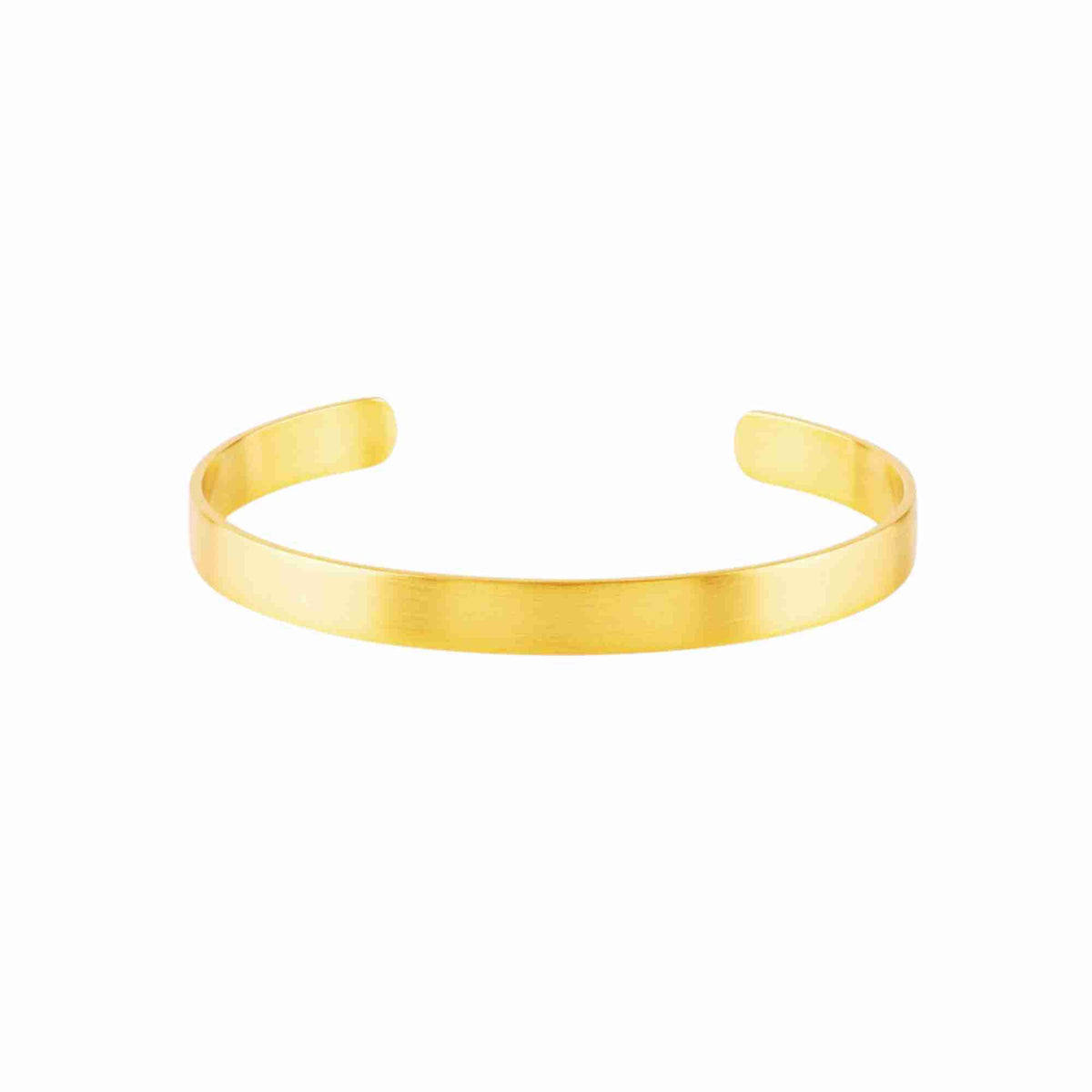 Signature flat cuff bracelet in gold, a single brushed open band, on a white background