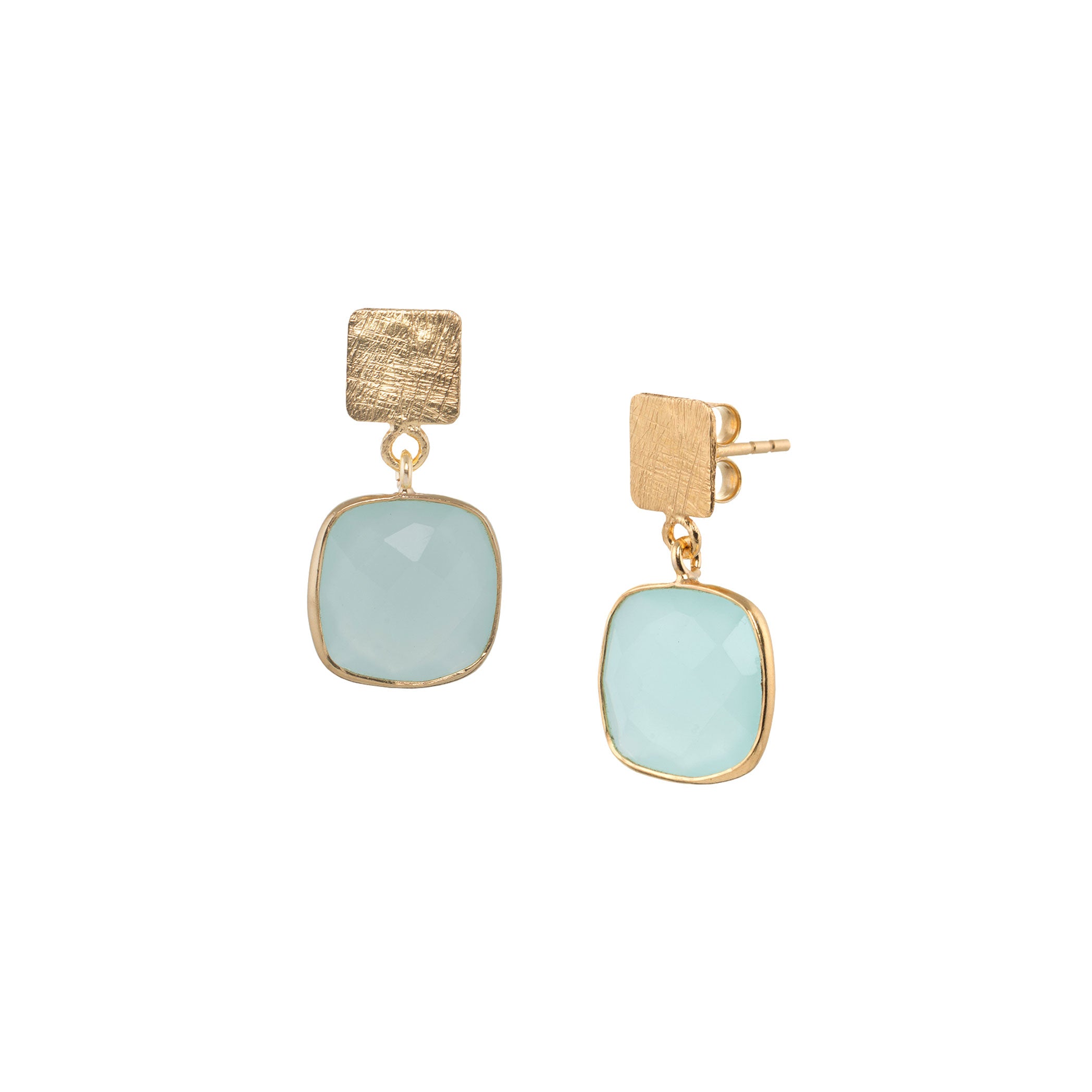 Product photography of Geo Glam Cushion-Cut Aqua Chalcedony Drop Earrings Gold, highlighting the faceted square translucent sea-foam blue gemstone suspended from a hand-textured matte gold square post — Protsaah Zurich.