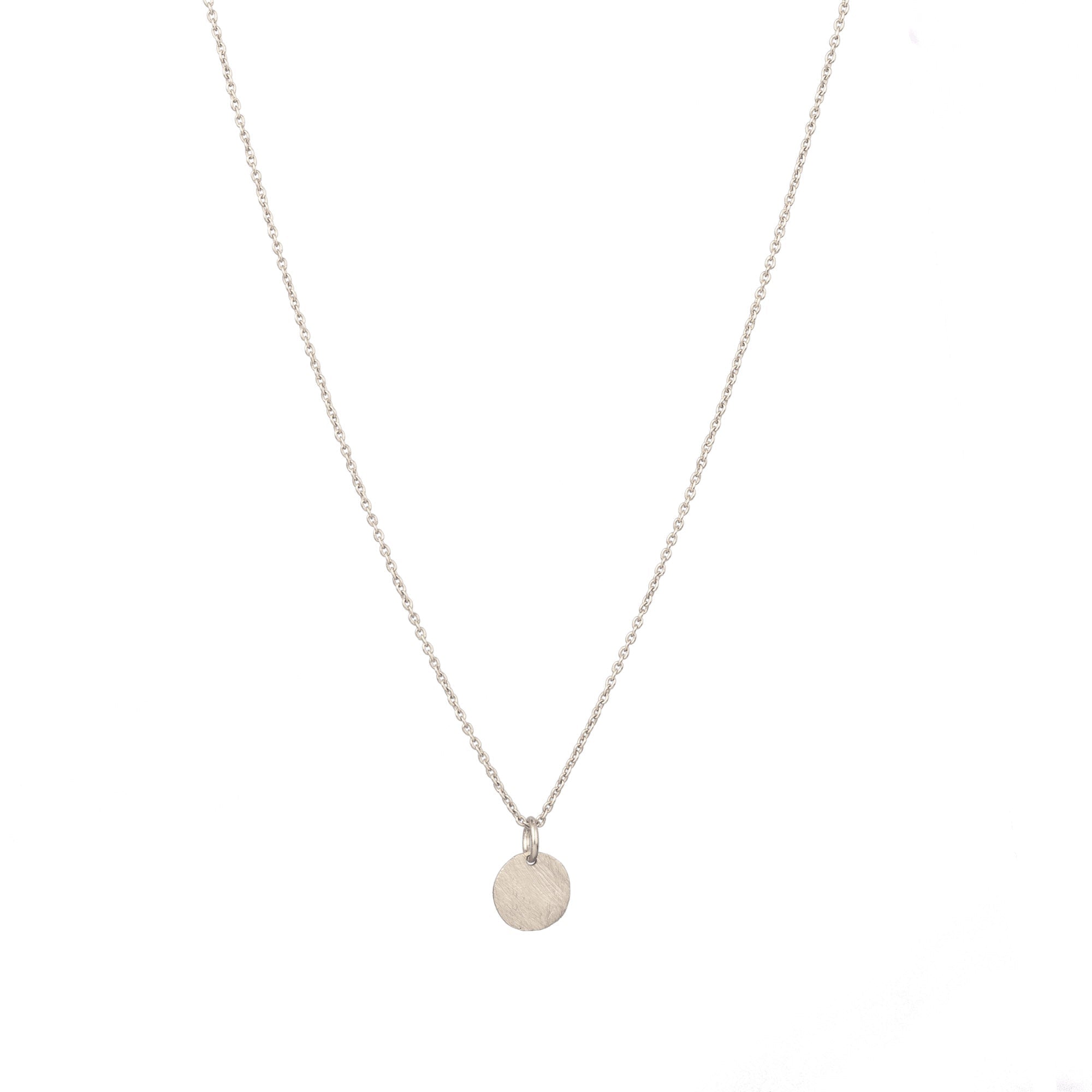 Shimmering Disks Silver Pendant Necklace; minimalist single 10mm disc design with a signature brushed-satin finish over 92.5 recycled silver.